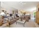 Bright and inviting living room with comfortable seating and seamless flow to the kitchen at 11099 E Desert Vista Dr, Scottsdale, AZ 85255
