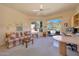 Inviting home office space with a comfortable couch and large windows showcasing scenic mountain views at 11099 E Desert Vista Dr, Scottsdale, AZ 85255