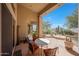Covered patio with patio furniture and a view of the desert landscape at 11099 E Desert Vista Dr, Scottsdale, AZ 85255