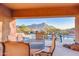 Inviting outdoor dining and pool area surrounded by desert landscaping and mountain views at 11099 E Desert Vista Dr, Scottsdale, AZ 85255