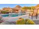 Relaxing community pool with cabana and comfortable seating surrounded by lush desert landscaping at 11099 E Desert Vista Dr, Scottsdale, AZ 85255