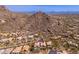 A mountainside neighborhood with upscale homes, swimming pools, and desert landscaping at 11187 E De La O Rd, Scottsdale, AZ 85255
