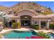 Home featuring a pool, patio, desert landscape and mountain views at 11187 E De La O Rd, Scottsdale, AZ 85255