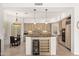 Bright open kitchen features granite counters, stainless appliances and a wine cooler at 11187 E De La O Rd, Scottsdale, AZ 85255