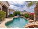 Beautiful pool with lush greenery and mountain views offers a tranquil outdoor space at 11187 E De La O Rd, Scottsdale, AZ 85255