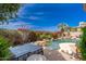 Relaxing pool area with lounge chair and lush landscaping offers a perfect outdoor escape at 11187 E De La O Rd, Scottsdale, AZ 85255