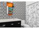 Modern bathroom with geometric tile and black and white patterned design at 11649 N Miller Rd, Scottsdale, AZ 85260