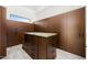 Walk-in closet with custom cabinetry, drawer island, and ample storage space at 11649 N Miller Rd, Scottsdale, AZ 85260