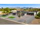 Expansive modern home featuring desert landscaping, 4 car garage, and views of the mountains at 11649 N Miller Rd, Scottsdale, AZ 85260