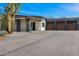 Stunning modern home with desert landscaping, grey brick accents, and a 4 car garage at 11649 N Miller Rd, Scottsdale, AZ 85260