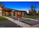 Modern home featuring desert landscaping, a geometric walkway, and a unique address marker at 11649 N Miller Rd, Scottsdale, AZ 85260