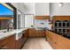 Modern kitchen featuring stainless steel appliances, sleek cabinets, and granite countertops at 11649 N Miller Rd, Scottsdale, AZ 85260