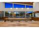 Open-concept kitchen with island seating, sleek countertops, and modern lighting fixtures at 11649 N Miller Rd, Scottsdale, AZ 85260