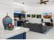 Bright and open living room and kitchen area with sleek furnishings and decorative lighting at 11649 N Miller Rd, Scottsdale, AZ 85260
