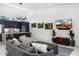 Bright living room featuring an open concept design, sleek furnishings, and access to the kitchen area at 11649 N Miller Rd, Scottsdale, AZ 85260