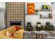 Chic living room with a fireplace, decorative screen, comfortable seating, and artistic decor at 11649 N Miller Rd, Scottsdale, AZ 85260