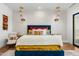 Comfortable main bedroom featuring accent lighting, a plush bed, and stylish decor at 11649 N Miller Rd, Scottsdale, AZ 85260