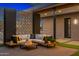 Inviting patio featuring stylish seating area with modern decor and brick accents at 11649 N Miller Rd, Scottsdale, AZ 85260