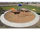 Aerial view showcasing community playground with sunshades and swing sets at 12427 E Wallflower Ln, Florence, AZ 85132