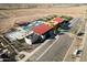 Aerial view showcasing the community pool and lounge area and outdoor grassy area at 12427 E Wallflower Ln, Florence, AZ 85132