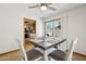 Dining area featuring tile flooring, natural light, and kitchen access at 153 W Hillside St, Mesa, AZ 85201