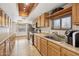 Kitchen with wood cabinetry, tiled countertops, and stainless steel appliances at 153 W Hillside St, Mesa, AZ 85201