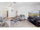 Open living area with neutral decor, tile flooring, and access to other rooms at 153 W Hillside St, Mesa, AZ 85201