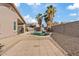 Spacious backyard with a private pool, mature palm trees, and comfortable patio space at 16585 W Tonto St, Goodyear, AZ 85338