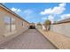 Paver patio and gravel area in the backyard, offering a clean and low-maintenance outdoor space at 16585 W Tonto St, Goodyear, AZ 85338