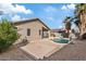 Inviting backyard pool area with palm trees, stone accents, and a neutral color scheme at 16585 W Tonto St, Goodyear, AZ 85338