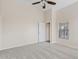 Bedroom featuring neutral walls, carpet flooring, a ceiling fan, and bright natural light at 16585 W Tonto St, Goodyear, AZ 85338