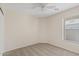 Bedroom featuring neutral walls, carpet flooring, a ceiling fan, and bright natural light at 16585 W Tonto St, Goodyear, AZ 85338