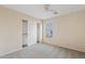 Bedroom featuring neutral walls, carpet flooring, and closet with sliding doors at 16585 W Tonto St, Goodyear, AZ 85338