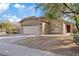 Inviting single-story home featuring a spacious two-car garage and desert landscaping at 16585 W Tonto St, Goodyear, AZ 85338