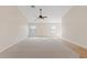 Spacious living room with a ceiling fan and carpet flooring at 16585 W Tonto St, Goodyear, AZ 85338