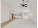 Open floor plan connecting the living room and kitchen with a ceiling fan at 16585 W Tonto St, Goodyear, AZ 85338