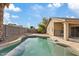 Beautiful pool with natural rock features and patio, perfect for outdoor enjoyment at 16585 W Tonto St, Goodyear, AZ 85338