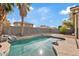Refreshing backyard pool, complete with privacy fence and mature palm trees at 16585 W Tonto St, Goodyear, AZ 85338