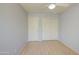 This bedroom features light wood floors, neutral wall paint, and closet space at 1720 W Orchid Ln, Chandler, AZ 85224