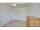 Neutral bedroom features a ceiling fan, spacious closet, and wood-look flooring at 1720 W Orchid Ln, Chandler, AZ 85224
