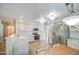 Bright kitchen boasts stainless steel appliances, plentiful cabinets, and stylish backsplash at 1720 W Orchid Ln, Chandler, AZ 85224