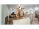 Living room with a fireplace, wood floors, a view of the kitchen and a comfy couch at 1720 W Orchid Ln, Chandler, AZ 85224