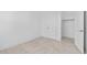 Bright bedroom featuring neutral carpet, white walls, closet, and doors at 20308 W Montecito Ave, Buckeye, AZ 85396