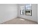 Neutral bedroom featuring carpet, white walls, windows and outlets at 20308 W Montecito Ave, Buckeye, AZ 85396