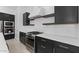Close-up of kitchen appliances, quartz countertops and dark cabinets at 20308 W Montecito Ave, Buckeye, AZ 85396