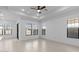 Bright, spacious living area with tile floors, tray ceiling, recessed lighting, ceiling fan and large windows at 20308 W Montecito Ave, Buckeye, AZ 85396