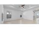Bright and airy living area with windows, tile flooring, recessed lighting, and ceiling fan at 20308 W Montecito Ave, Buckeye, AZ 85396
