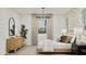 Bright bedroom featuring a large bed, stylish lighting, and tasteful decorations creating a serene space at 20900 S 231St Way, Queen Creek, AZ 85142