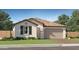Charming single-story home featuring a tiled roof, attached garage, and manicured front lawn at 20900 S 231St Way, Queen Creek, AZ 85142