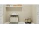 Clean laundry room featuring ample storage with a shelf, baskets, and hamper at 20900 S 231St Way, Queen Creek, AZ 85142